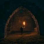 person holding torch in building interior