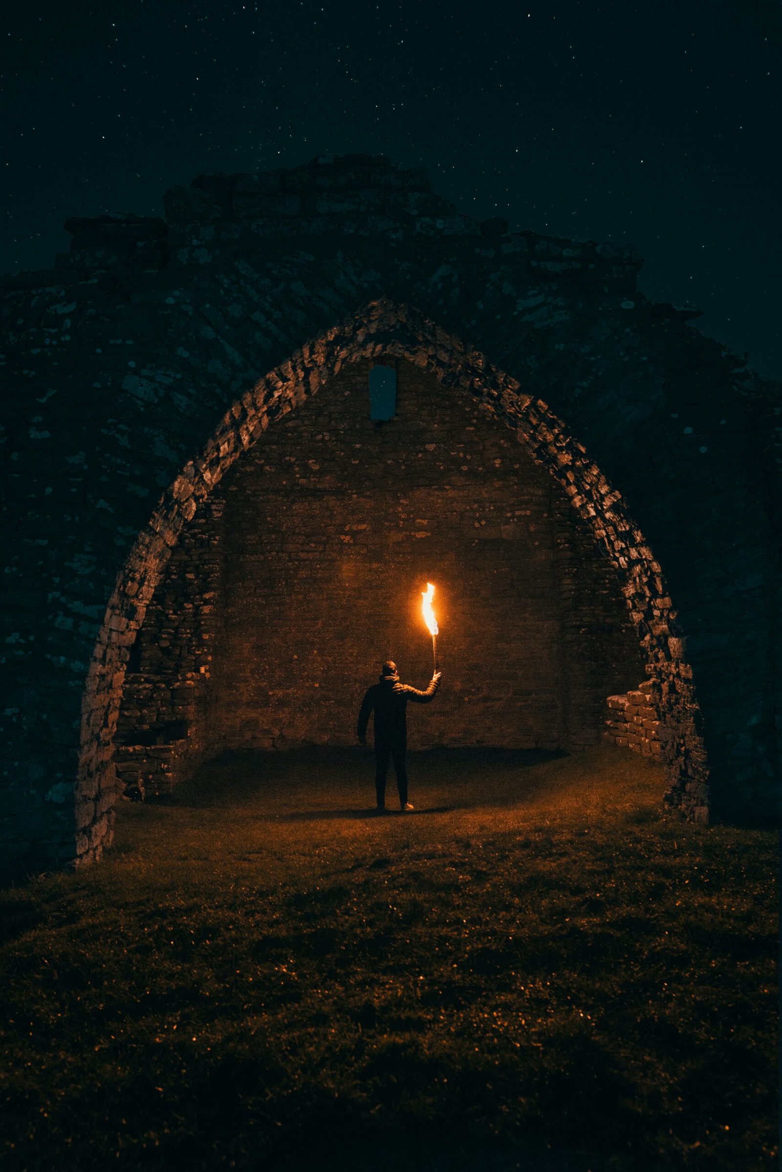 person holding torch in building interior